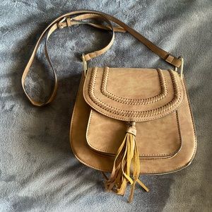 Western style purse with five pockets. Purchased from local boutique